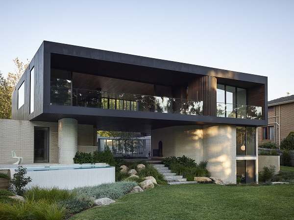 A tranquil multi-generational home bonded to its surroundings and landscape